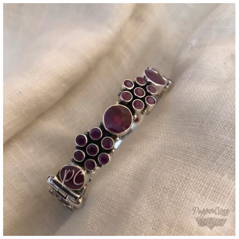 Ruby flower pattern silver bangle.