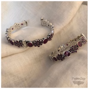 Ruby flower pattern silver bangle.